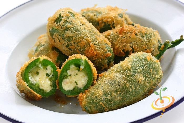 Plate of crispy stuffed jalapeño peppers with melted cheese filling