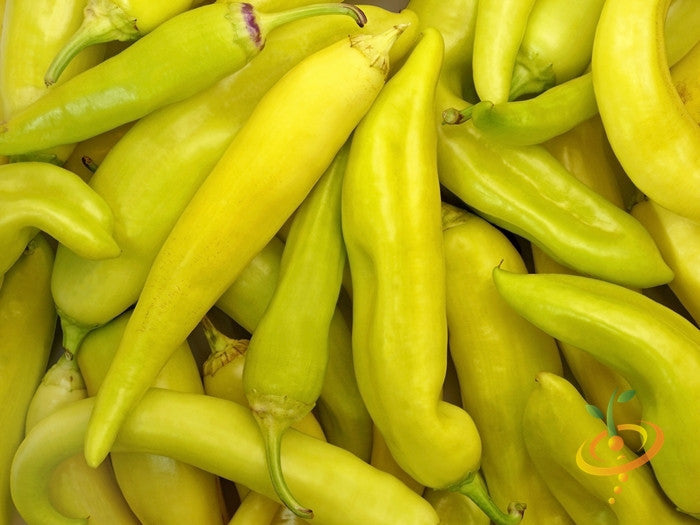 Sweet banana pepper seeds from SeedsNow, showing vibrant yellow peppers and seeds, ideal for home gardening and fresh cuisine.