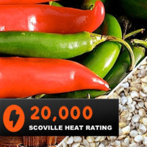 Close-up of Serrano Tampiqueño peppers in green and red with 20,000 Scoville heat rating badge and seeds background